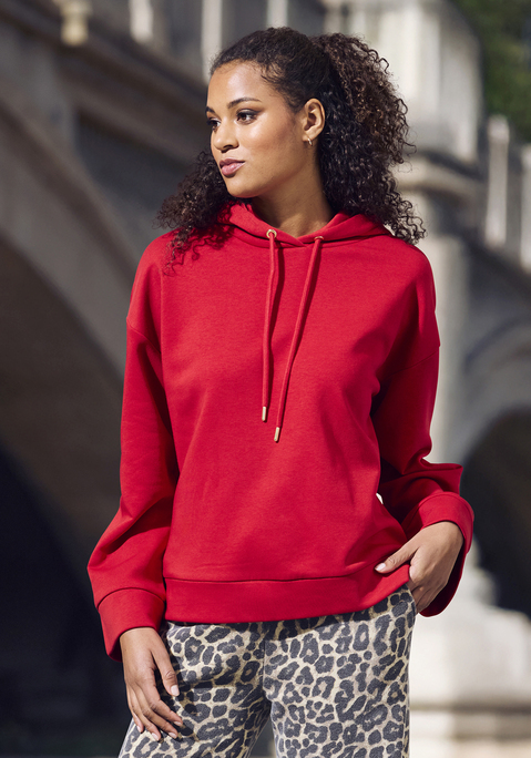 Bild: Hoodie von Buffalo: Entspannter Hoodie von Buffalo zum Loungen und Relaxen. Lockere Silhouette mit überschnittenen Schultern, weiten Ärmeln und breiten Bündchen. Kapuze mit farbgleichen Futter und Kordelzug. Softe Sweatqualität.