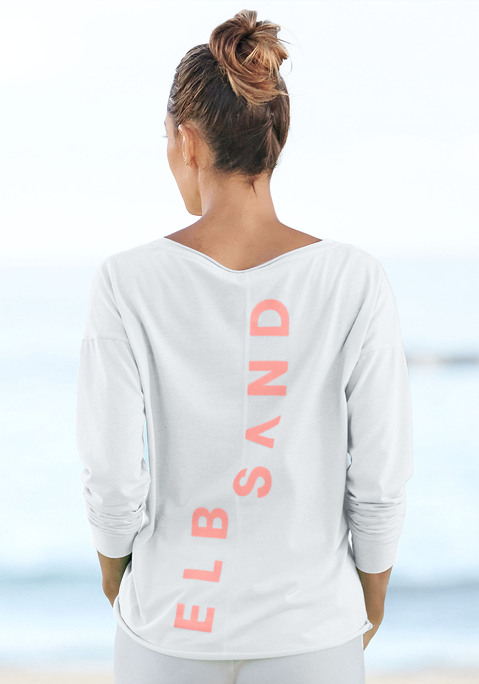 Bild: Langarmshirt von Elbsand: Shirt von ELBSAND mit großem Logoprint und Teilungsnaht auf dem Rücken. Überschnittene Schultern und lange Ärmel. Länge ca. 62 cm. Aus 50% Baumwolle, 50% Polyester.