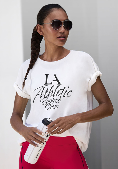 Bild: T-Shirt von LASCANA ACTIVE: Lässig geschnittenes Performance-T-Shirt von Lascana Active mit Rundhalsausschnitt und großem Print vorn. Überschnittene Schultern. Für Freizeit und Sport. Trageangenehmer Jersey.