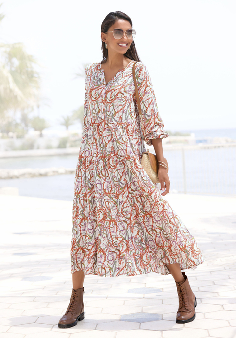 Bild: Maxikleid von LASCANA: Maxikleid von Lascana mit V-Ausschnitt und Alloverprint – jedes Teil ein Unikat. Lange Ärmel mit elastischem Saum. Ausgestellter Rockteil mit Volants. Weich fließende Webware aus Viskose.