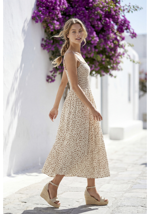 Bild: Midikleid von LASCANA: Midikleid von Lascana mit gepunktetem Alloverprint. Gesmoktes Bustier mit verstellbaren Spaghettiträgern und Rüschenkante. Figurumspielender Rockteil in Wadenlänge. Weich fließende Viskose-Webware.