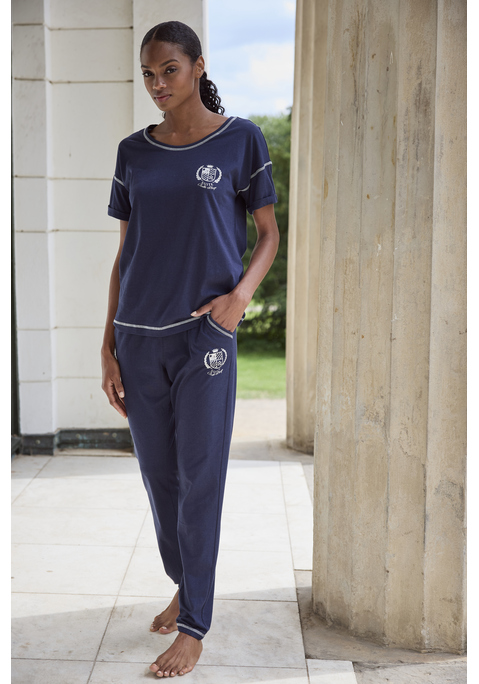 Bild: Pyjama von LASCANA: Kurzärmeliger Pyjama mit Kontraststeppungen. Aus 50% Baumwolle, 50% Viskose.