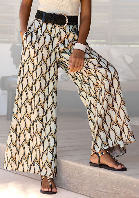 Bild: Strandhose von LASCANA: Satinhose von Lascana mit weitem Bein. Glatter Bund vorn. Elastischer Smokbund hinten. Seitennahttaschen. Leicht glänzende Satinware.