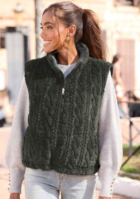 Bild: Wendeweste von LASCANA: Wendeweste von Lascana. Eine Seite mit Steppung und aufgesetzten Taschen, die andere Seite aus Fellimitat mit Zopfmuster-Optik. Stehkragen. Vorn durchgehender Reißverschluss. Tunnelzug mit Kordelstoppern am Saum. Ärmellos, hüftlang. Weiche Qualität.