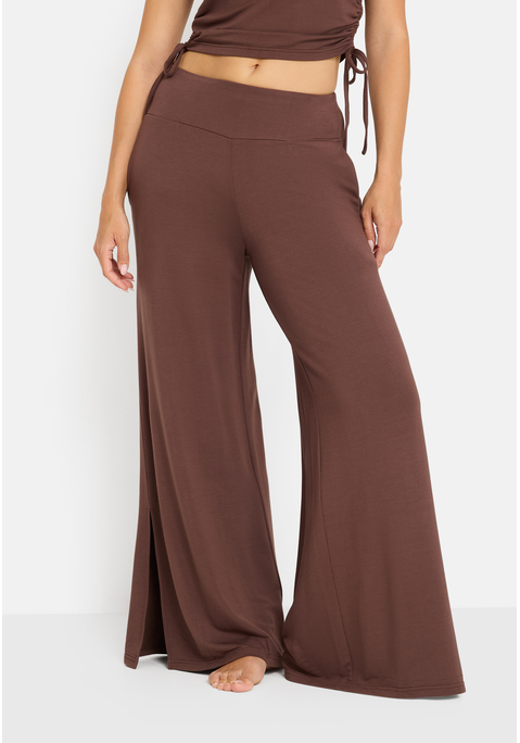 Bild: Loungehose von LSCN by LASCANA: Mit weitem Bein: unifarbene Loungehose von LSCN by Lascana. Breiter, elastischer Bund für viel Tragekomfort. Beine mit seitlichen Schlitzen. Zu vielen verschiedenen Oberteilen kombinierbar. Hochwertige, herrlich weiche Qualität.