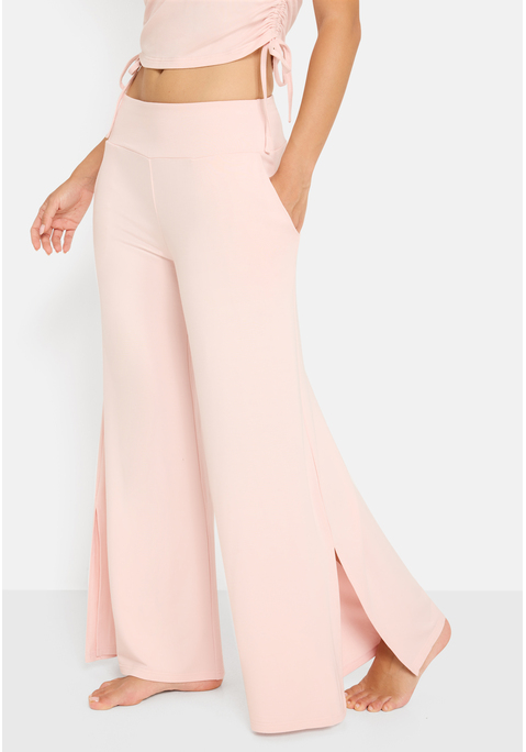 Bild: Loungehose von LSCN by LASCANA: Mit weitem Bein: unifarbene Loungehose von LSCN by Lascana. Breiter, elastischer Bund für viel Tragekomfort. Beine mit seitlichen Schlitzen. Zu vielen verschiedenen Oberteilen kombinierbar. Hochwertige, herrlich weiche Qualität.