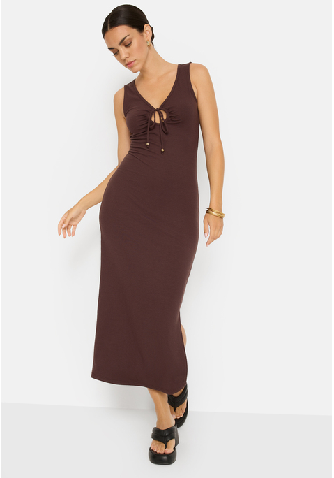 Bild: Maxikleid von LSCN by LASCANA: Unifarbenes ärmelloses Maxikleid von LSCN by Lascana. V-Ausschnitt mit rundem Cut-out-Detail. Bindeband mit Zierperlen vorn am Ausschnitt. Kleiner Seitenschlitz im Rockteil. Sehr figurbetont. Weiche, elastische Rippware.