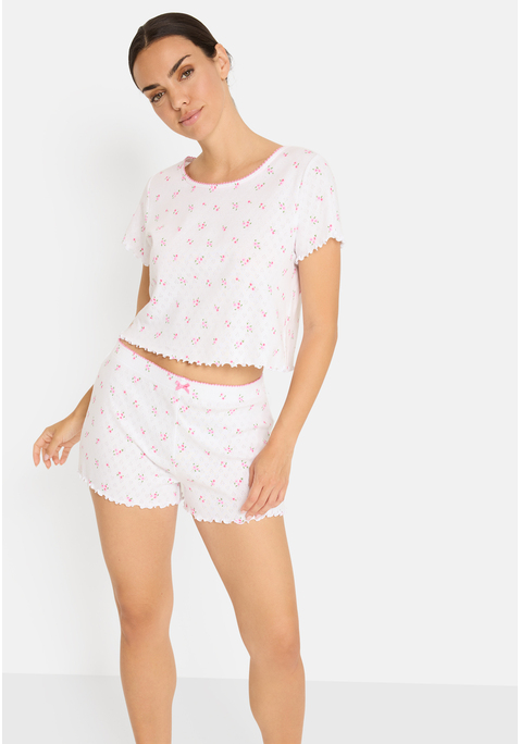 Bild: Shorty von LSCN by LASCANA: Shorty von LSCN by LASCANA mit Babylock-Saum. Blümchen-Print. Kurzarm. Eingesetzte Ärmel. Rundhals mit Häkelkante. Shirt mit Kräuselsäumen. Kurze Hose mit elastischem Bund, Zierschleife und Kräuselsaum. Ajour-Strick aus reiner Baumwolle. Jersey. Figurumspielende Passform. Femininer Stil.