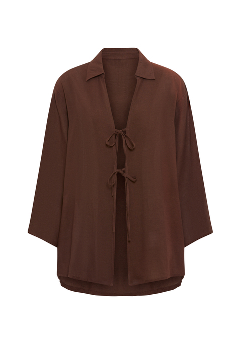 Bild: Tunika von LSCN by LASCANA: Lässige Strand-Tunika von LSCN by Lascana mit langen Ärmeln und Blusenkragen. Vorne offen und mit je zwei Bändern zum Binden versehen. Gerader Saum vorne, hinten abgerundet und tiefer fallend. Trageangenehme Qualität mit Viskose.