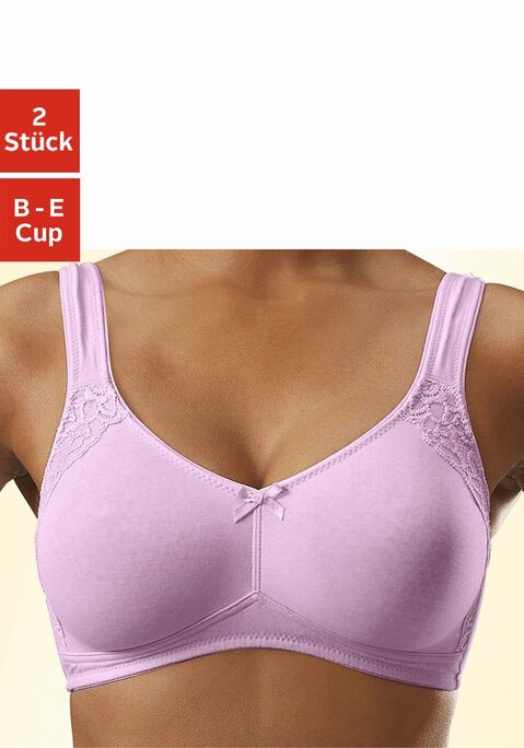 Bild: Soft-BH von petite fleur: Bequemer Basic-BH im praktischen Doppelpack. Der BH von Petite Fleur liegt mit seinen nahtlos vorgeformten, unwattierten Cups angenehm weich auf der Haut. Es gibt keine störenden Bügel. Halt und Komfort entsteht durch die abdeckendere Schnittform, das breitere Unterbrustgummi und die breiten Träger. Als hübsche Verzierung ist seitlich am Cup eine flache Blütenspitze aufgesetzt und in der vorderen Mitte eine Schleife angebracht. Die Träger und der Rückenverschluss sind verstellbar.  Aus weicher Baumwolle für ein rundum tolles Tragegefühl im Alltag. BH aus 85% Baumwolle, 10% Polyamid, 5% Elasthan. BHs sind nicht trocknergeeignet, da die Versteller und Ringe durch die Hitze beschädigt werden und brechen.