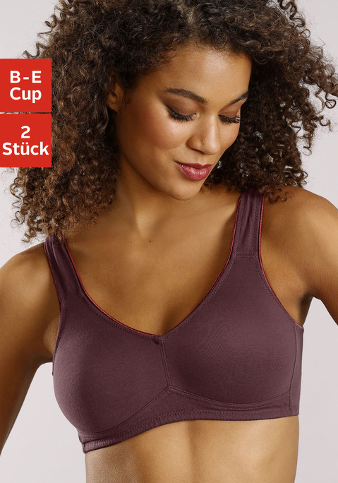Bild: Soft-BH von petite fleur: Toller Basic BH ohne Bügel von Petite Fleur im Doppelpack. Die nahtlos vorgeformten, unwattierten Cups schmiegen sich sanft an und sind ideal für eng anliegende Kleidung, da sich nichts abzeichnet. Die breiteren Träger geben verlässlichen Halt und verhindern ein unangenehmes Einschneiden auf den Schultern. Mit steigender Größe ist die Passform auf die jeweiligen besonderen Bedürfnisse abgestimmt, d.h. pro Größe wachsen auch die Rückteile und Verschlussbreiten mit. Für hohen Tragekomfort sorgen breitere Elastikbänder entlang der Kanten, die dank hochelastischer Nähte nicht einschneiden. Träger und Rückenverschluss sind verstellbar.  Aus 95% Baumwolle, 5% Elasthan. <br/><br/> BHs sind nicht trocknergeeignet, da die Versteller und Ringe durch die Hitze beschädigt werden und brechen.