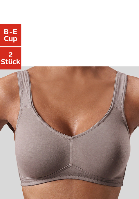 Bild: Soft-BH von petite fleur: Toller Basic BH ohne Bügel von Petite Fleur im Doppelpack. Die nahtlos vorgeformten, unwattierten Cups schmiegen sich sanft an und sind ideal für eng anliegende Kleidung, da sich nichts abzeichnet. Die breiteren Träger geben verlässlichen Halt und verhindern ein unangenehmes Einschneiden auf den Schultern. Mit steigender Größe ist die Passform auf die jeweiligen besonderen Bedürfnisse abgestimmt, d.h. pro Größe wachsen auch die Rückteile und Verschlussbreiten mit. Für hohen Tragekomfort sorgen breitere Elastikbänder entlang der Kanten, die dank hochelastischer Nähte nicht einschneiden. Träger und Rückenverschluss sind verstellbar.  Aus 95% Baumwolle, 5% Elasthan. <br/><br/> BHs sind nicht trocknergeeignet, da die Versteller und Ringe durch die Hitze beschädigt werden und brechen.