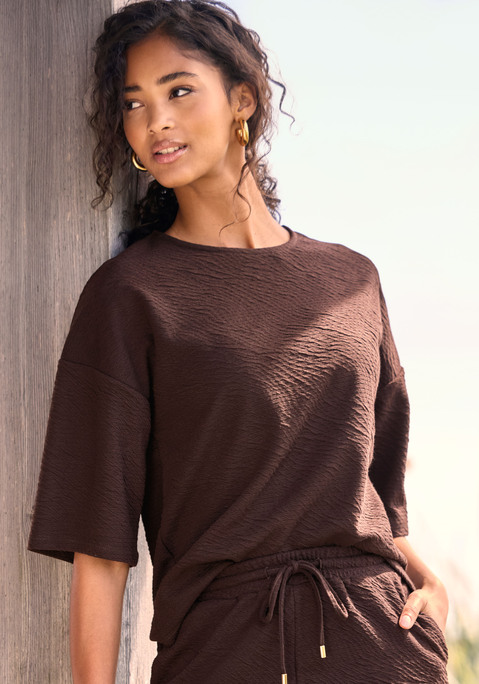 Bild: Rundhalsshirt von Venice Beach: Unifarbenes Rundhalsshirt von Venice Beach. Mit halblangen, überschnittenen Ärmeln und lockerem Oversize-Fit. Hüftlang mit geradem Saum. Vielseitig kombinierbar mit Shorts oder Hosen. Strukturierte Sweatware.