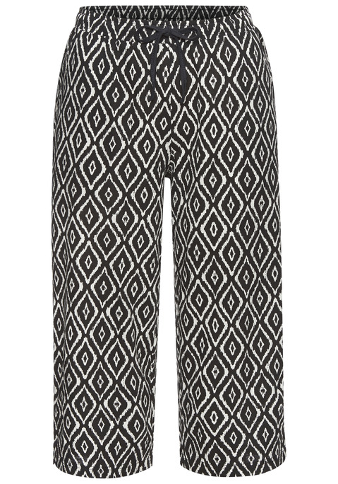 Bild: Caprihose von Vivance Dreams: Capri-Schlafhhose von Vivance Dreams. Blickfang: das schöne Muster. Schmale Form mit Schlitz am Saum. Elastischer Bund und Bindeband. Ausgestattet mit praktischen Eingriffstaschen. Komfortabler Single -ersey aus reiner Baumwolle.